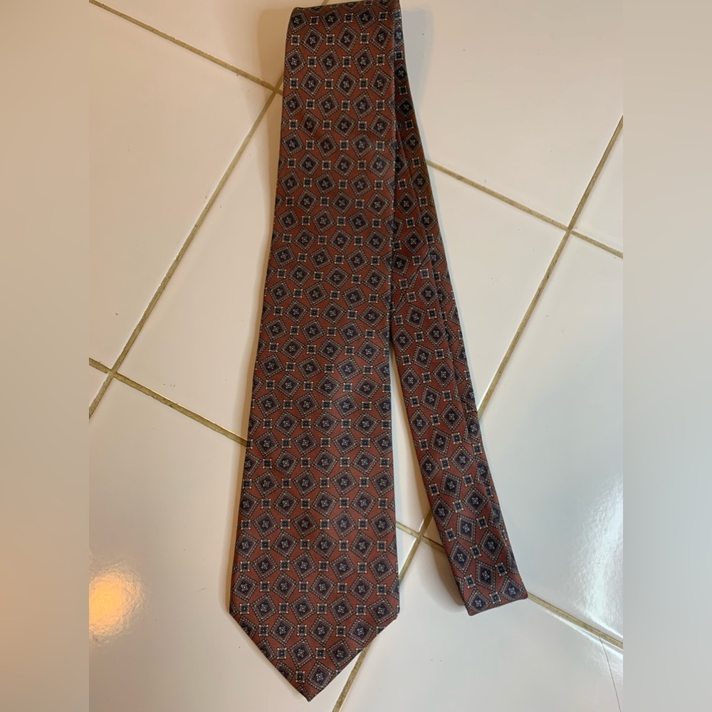 Mallory Church purple tie with off-set and different sized squares.
